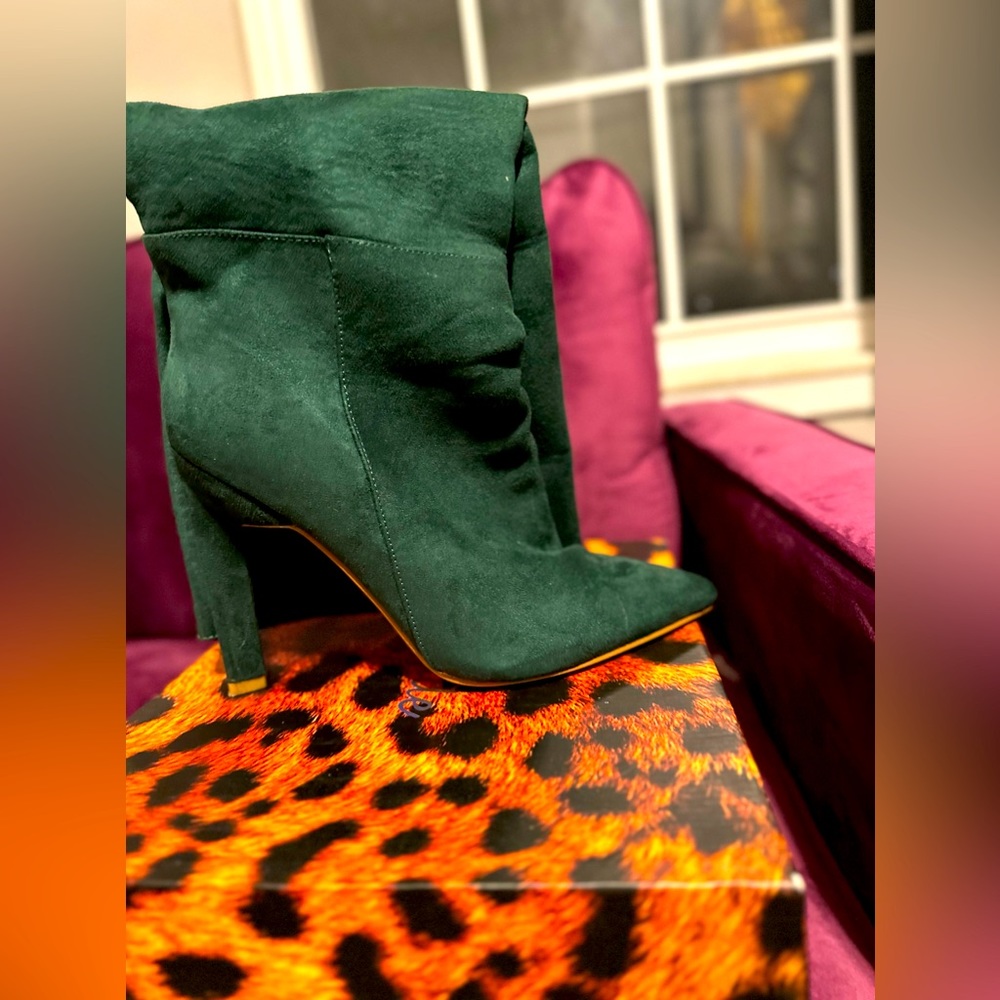 Beautiful Green heeled fashion boots. Paid $75. Asking $35. Never worn.